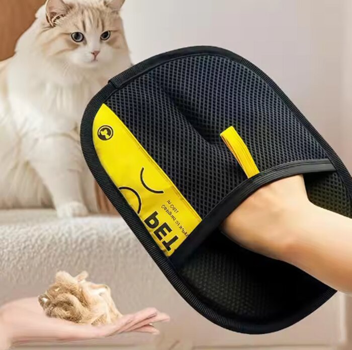 FurSwipe glove in use on a cushion